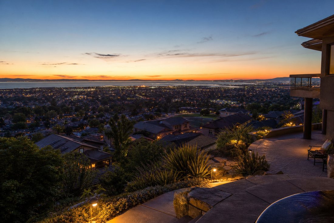 Evening view over East Bay rooftops toward San Francisco Bay from the Hayward hills